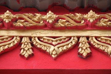 Thai art carving on beam of temple, Wat Lhao Yao, Borabue,