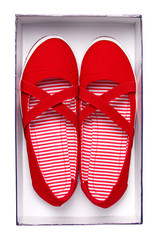 Female red shoes in box isolated on white. With path.