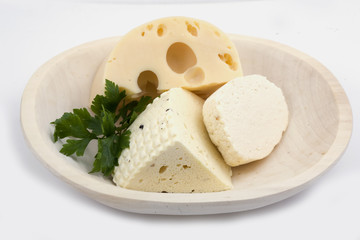 Wooden plate with cheese isolated