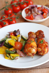 Spicy chicken legs with roasted vegetables