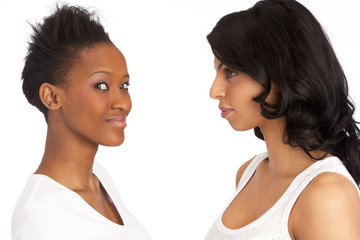 Portrait Of Two Attractive Young Women In Studio