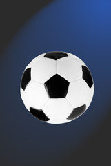 Fototapeta premium black and white soccer ball isolated on the blue and grey gradi