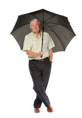 Happy casual mature man with umbrella