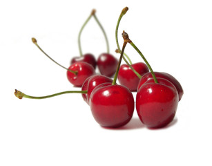 Naklejka na ściany i meble Juicy cherries isolated on white background