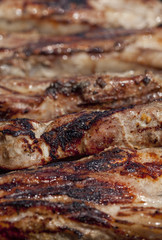 Obraz na płótnie Canvas seasoned pork chops ribs on a bbq