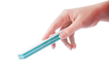 woman's hand with the nail file isolated on white background