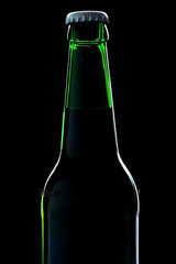 beer bottle close-up over black background