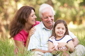 Grandfather With Daughter And Granddaughter In Park