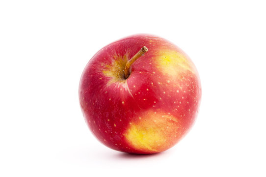 red and yellow apple with a drop a shadow in white background