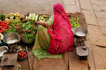 Foto op Canvas Indian Colorfully women seling vegetables on the street © Rafal Cichawa