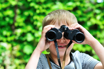 Boy looking through binocular