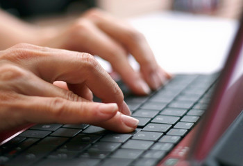 Woman hands writting on  laptop