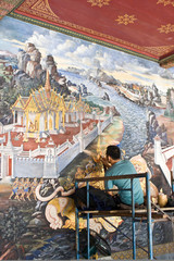 The painter repaint the mural