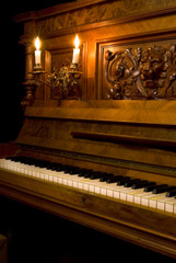 Retro piano with candle light