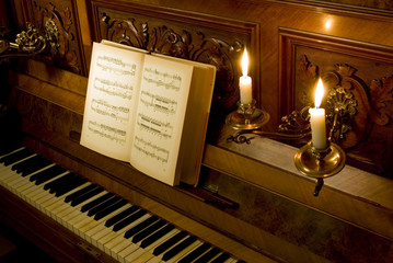 Retro piano with candle light