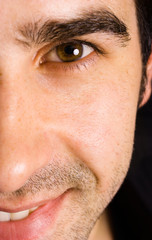 Obraz premium Close up portrait of an young attractive man on a black backgrou