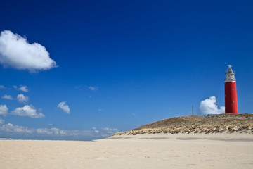 Lighthouse in the dunes at the beach