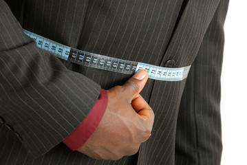 Black business man wearing a measuring tape