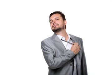 Tired businessman taking off his tie. Isolated on white.