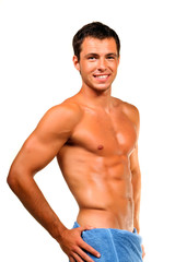 Fototapeta premium Handsome muscular man with the towel.