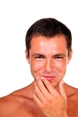 Naklejka premium Closeup portrait of a handsome young man with mouth full