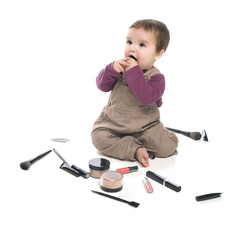 Baby girl with cosmetics