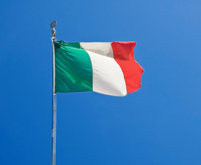 Italian flag on blue sky.