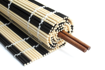 Rolled bamboo mat with a pair of chopsticks inside