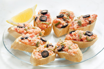salmon tartare with capers and black olives