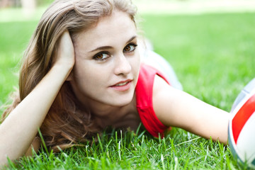 Attractive girl lay on grass