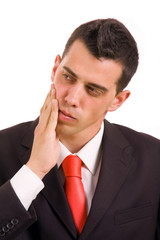 business man whith a toothache over white background