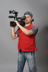 Cameraman in red vest