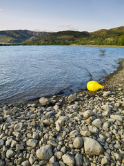 Fototapeta na wymiar Yellow Buoy in the Lake Sant Antoni