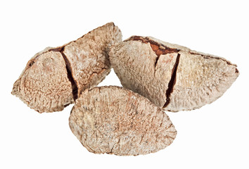 Few whole shelled Brazil nuts isolated on white
