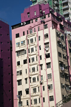 facade of houses downtown Kowloon with appartments and air condi