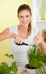 Young beauty woman cut chives