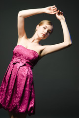 Beautiful young woman wearing pink dress
