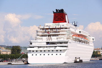 Obraz premium luxury white cruise ship shot at angle at water level