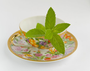 tea cup with mint leaf