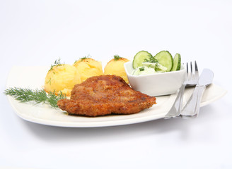 Pork chop, mashed potatoes and cucumber salad