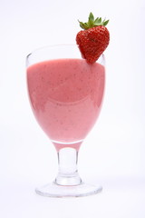 Strawberry shake in a glass decorated with a strawberry