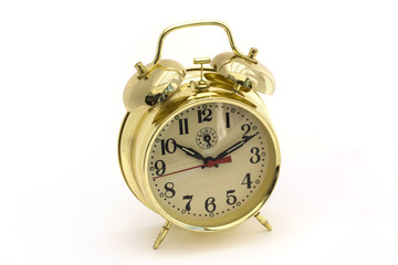 Fototapeta na wymiar gold alarm clock over white