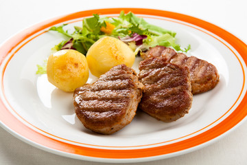 Grilled steaks and vegetables