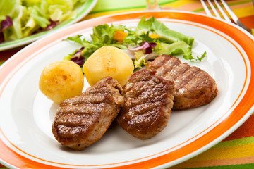 Grilled steaks and vegetables