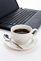 Coffee cup and computer