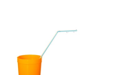 Yellow cup with blue drinking straw and water drops