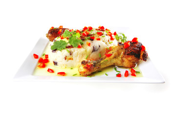 chicken drumsticks served on white