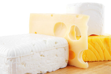 cheeses on wooden board