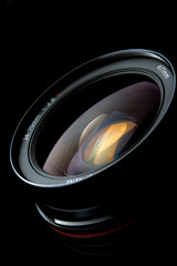Photo lens with reflections on black background