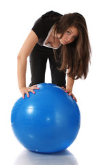 Fototapeta premium girl about a gymnastic ball, isolated.